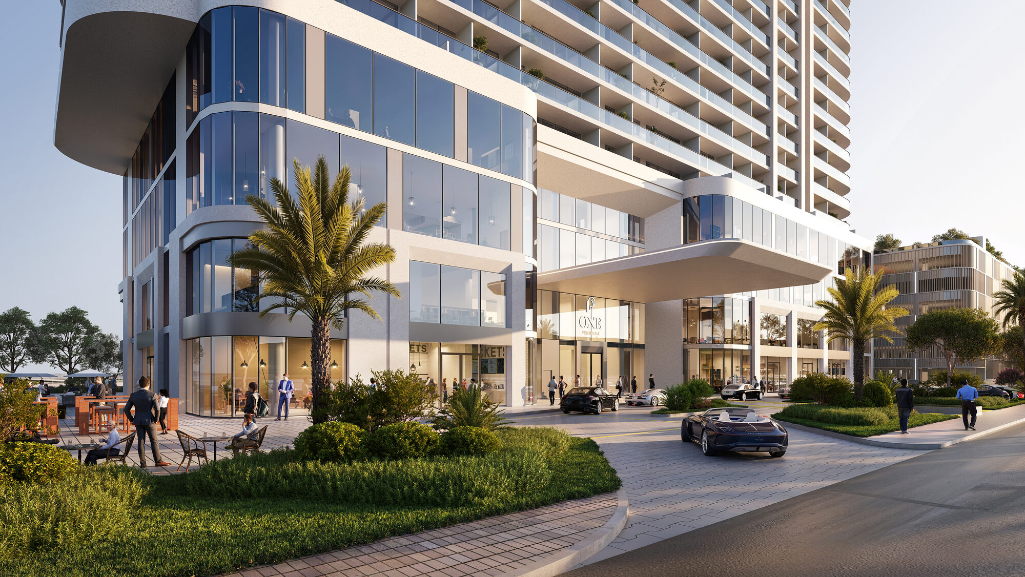 כניסת הרזידנסים והלובי ONE PENINSULA Batumi by HOLM Developments — street-level entrance, glazed lobby and landscaped gardens of the residences