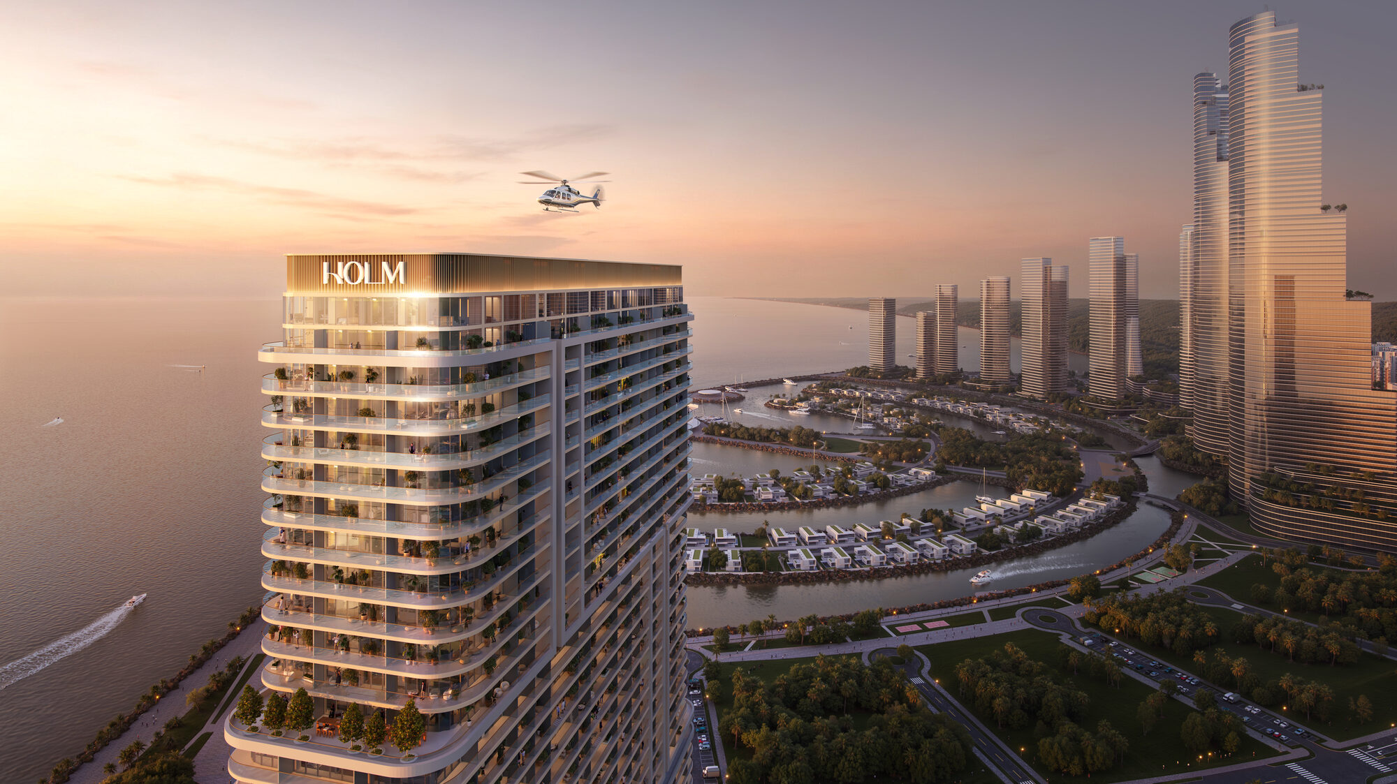 מגדל HOLM בשקיעה, האי אמבסדורי ONE PENINSULA Batumi by HOLM Developments — illuminated HOLM tower at sunset seen from a helicopter above Ambassadori Island