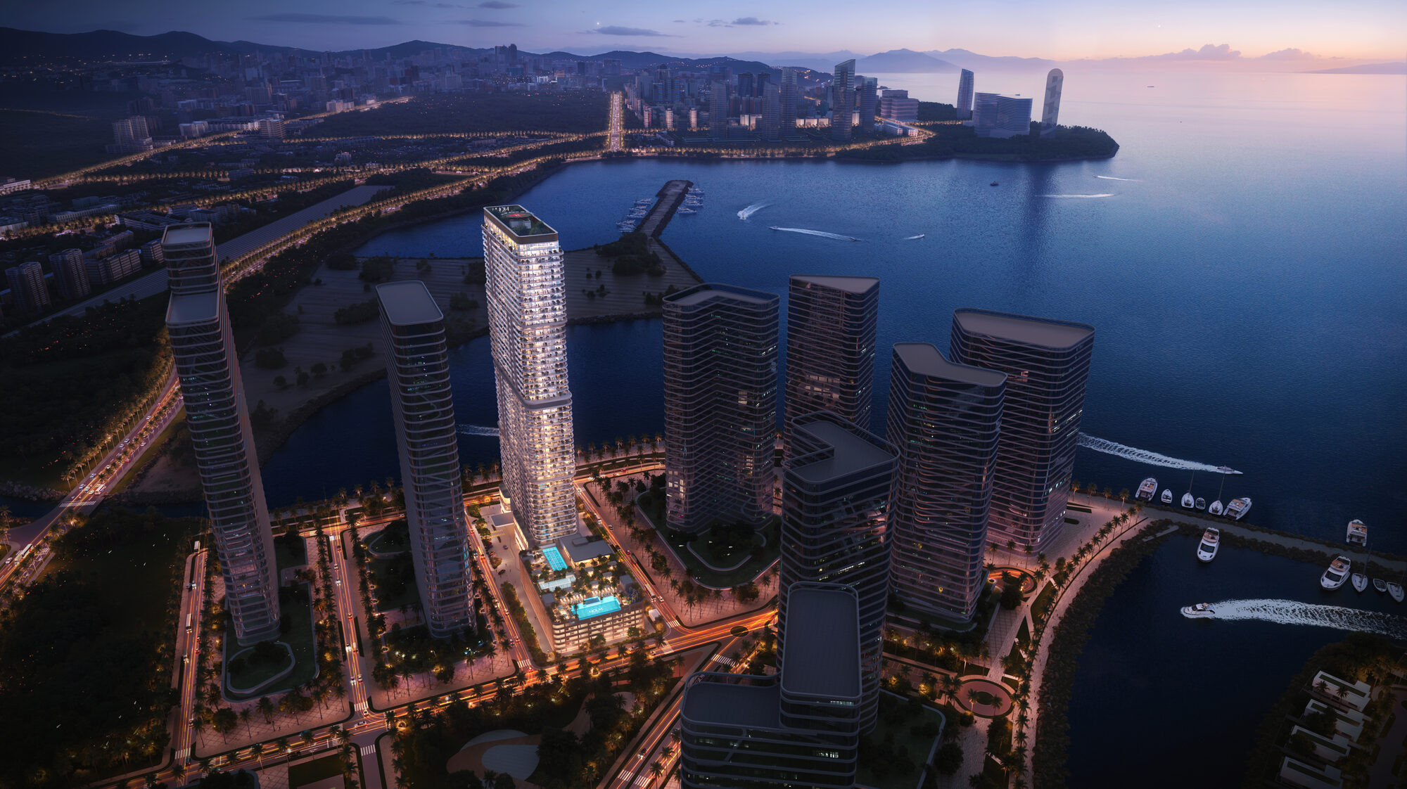 קו הרקיע של האי אמבסדורי בלילה ONE PENINSULA Batumi by HOLM Developments — night aerial view of the Ambassadori Island skyline lit up along the Batumi seafront